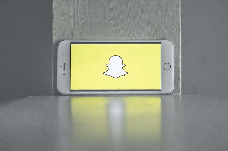 phone with snapchat logo that is ready for a branded snap filter for your business