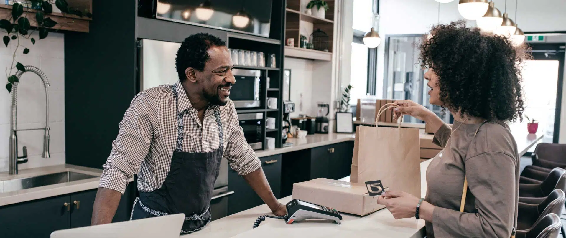 Customer happily purchasing a product
